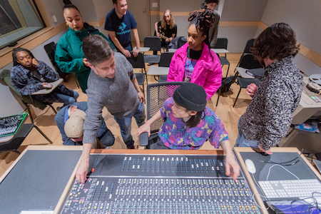 Brian McTear shows students the mixing board during Analog Recording class.