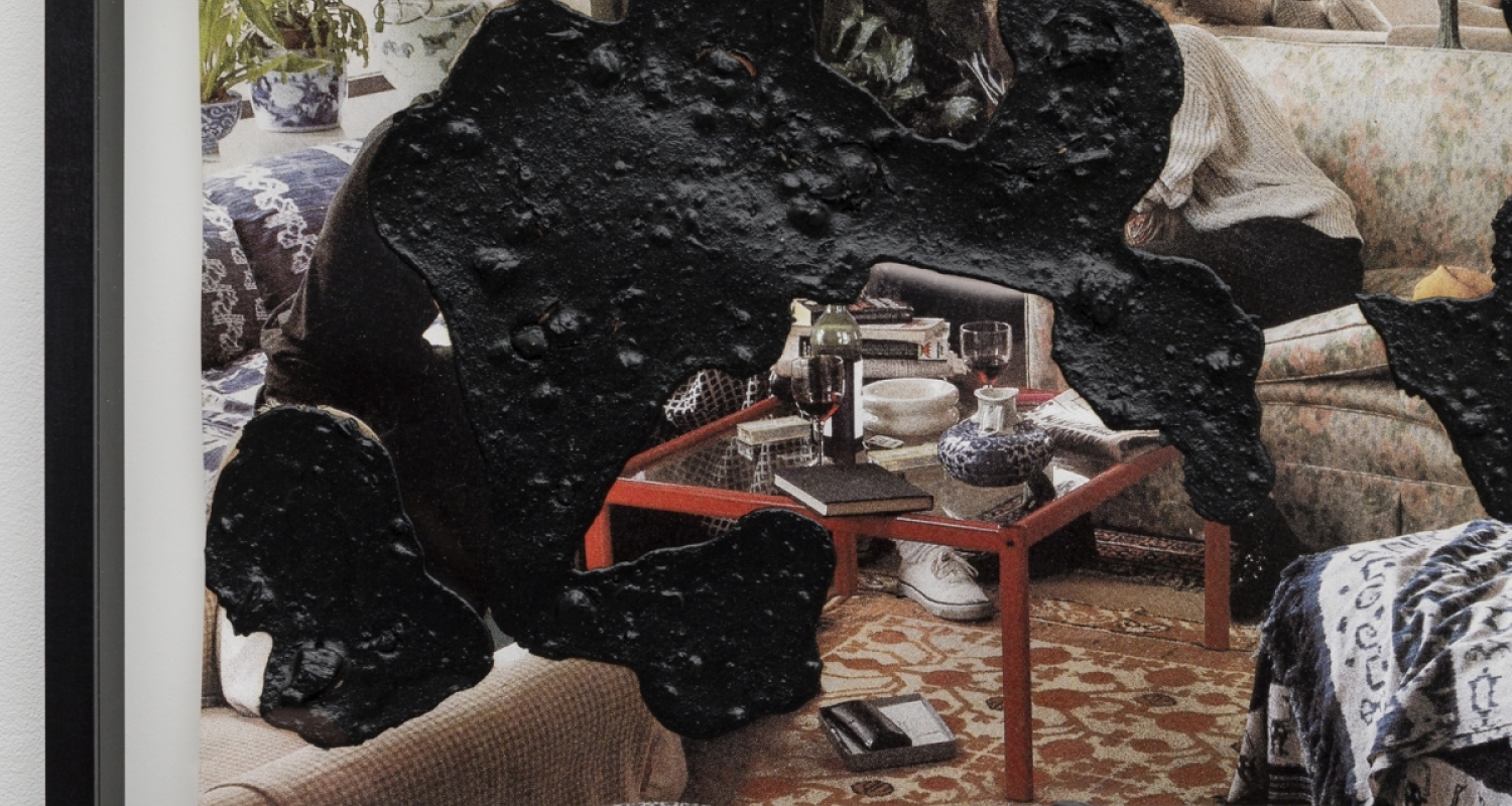 Black amorphous shapes obstruct a background image of an interior space with fragments of two seated figures, a patterned rug, couch, lamps, house plants and a coffee table with a wine bottle and wine glasses visible. 