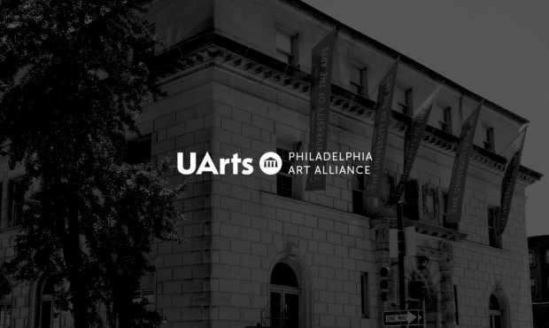 the exterior of the Art Alliance building with a dark overlay on it. The words UArts Philadelphia Art Alliance are overlaid on the image in white font with a white UArts logo mark