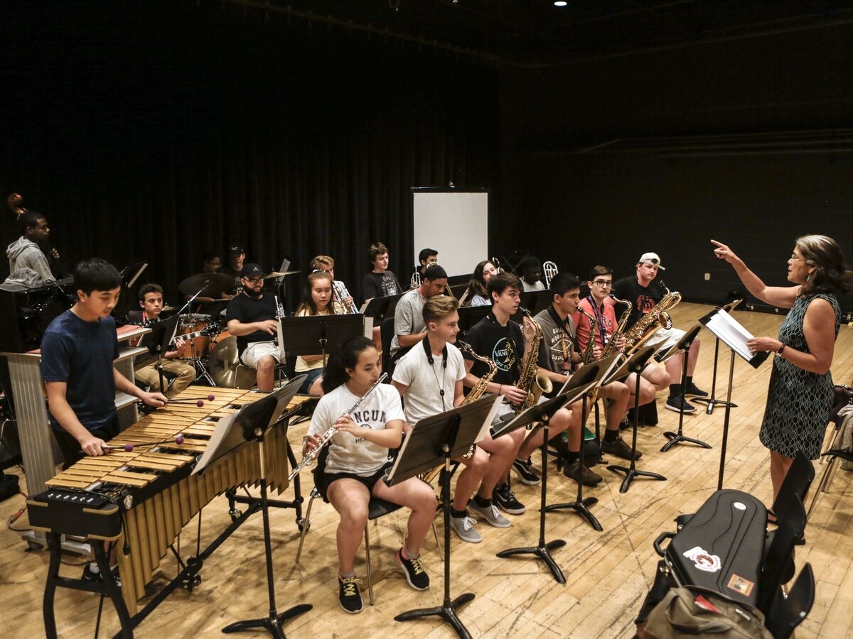 A jazz band rehearses on stage