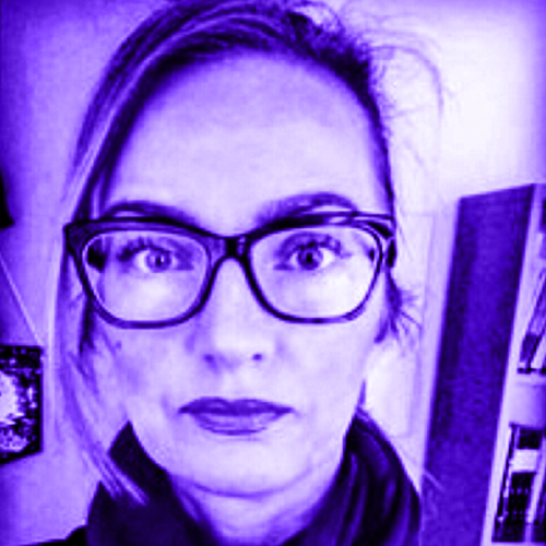 headshot of emily mattingly overlaid with a violet gradient. emily is wearing wide horn-rimmed acrylic glasses and has her hair up and pursed lipstick-lined lips