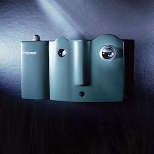 A light blue Mugshot Polaroid camera.