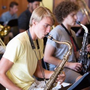 The saxophone section rehearses their music