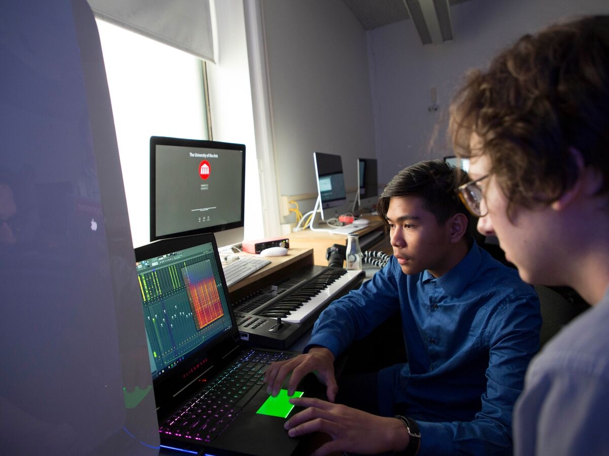 Music students work on digital music on their computer