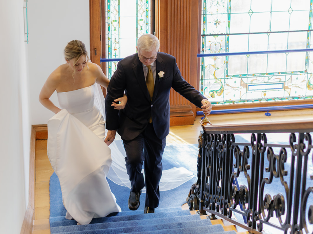 bride and father of the bride walking up main staircase in Philadelphia Art Alliance